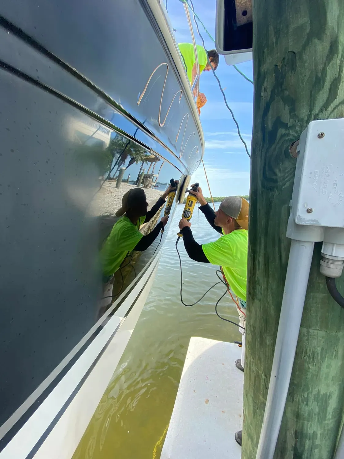 Kleen All Boats crew detailing a vessel in Charlotte County