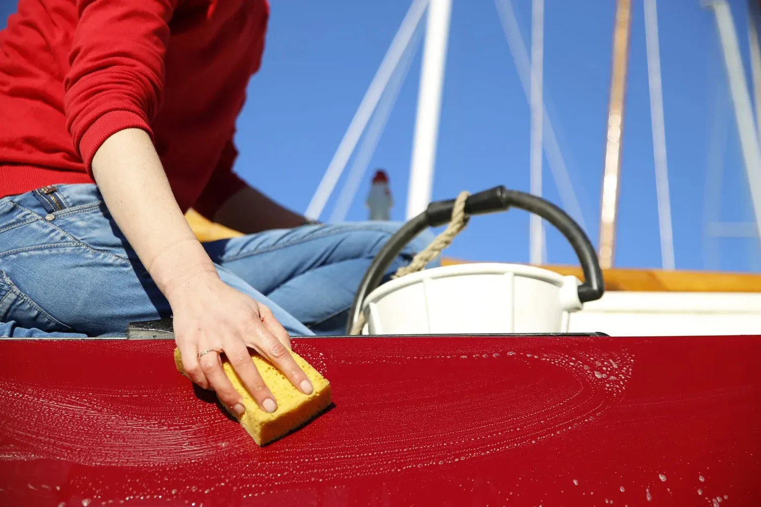 Close-up of a boat hull being cleaned to remove waterline stains